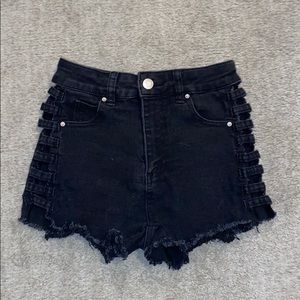 Black jean shorts from Litz with cut sides.